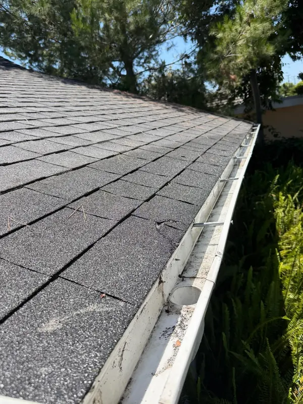The same gutter empty and clear after cleaning