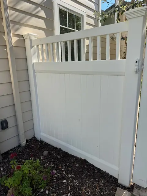 Vinyl fence before cleaning, photo by Gretchen T.